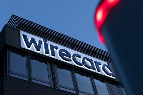 Der Schriftzug von Wirecard an der Firmenzentrale in Aschheim bei München. Foto: dpa